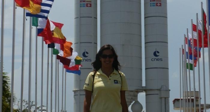 Valentini Aristotelous &#039;03 in front of an Ariane rocket in Kourou, French Guiana during a launch campaign.